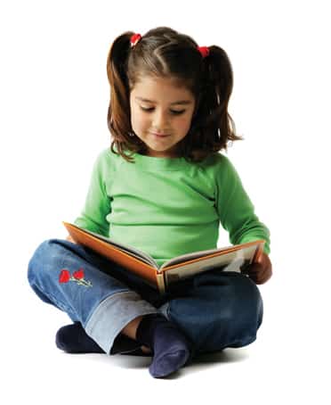 Little Girl Enjoying a Book